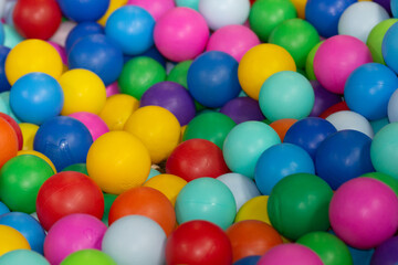 Fototapeta na wymiar Many multicolor balls in play center on playground