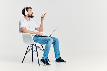 bearded man listening to music on headphones entertainment