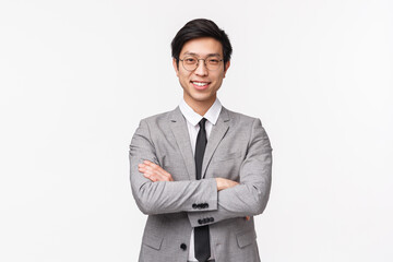 Waist-up portrait of confident smart and talented asian businessman, successful employer in grey...