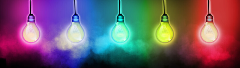 Idea and future concept with lightbulbs and rainbow lighting effects