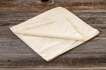 Yufka on wood floor. Mediterranean cuisine delicacies