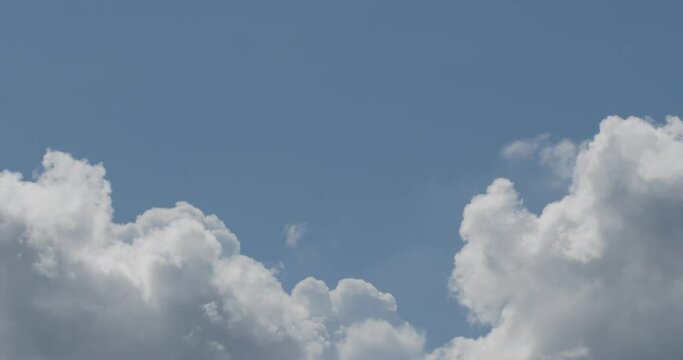 The time-lapse sky was bright with clouds that were moving quickly.