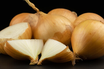 Whole and haft group pile ingredient of fresh onion  group isolated on black background