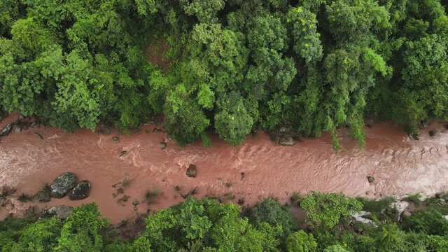 Move the camera Aerial drone shot Top view, Lam Wa is a tributary Flows through at village Sapan in Nan province, Thailand