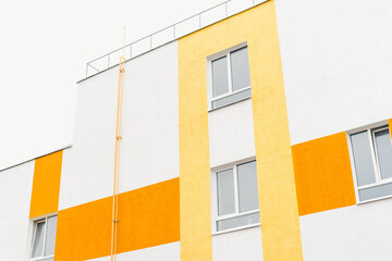 Bright house against the sky. Roof of the house. New building. Colored house. 