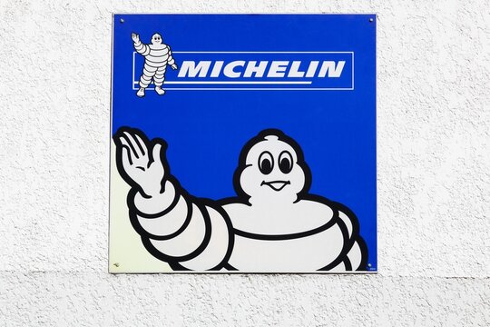 Jassans, France - March 28, 2020: Michelin logo on a wall. Michelin is a tire manufacturer based in Clermont-Ferrand in France and it's one of the three largest tire manufacturers in the world