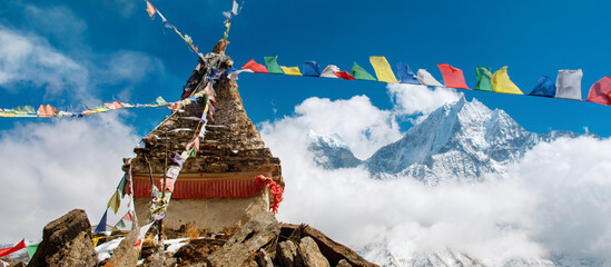 Panoramic view of Buddhist stupa in mountains, Nepal.