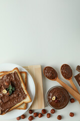 Concept of delicious food with chocolate paste on white background