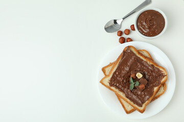 Concept of delicious food with chocolate paste on white background