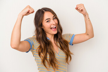 Young caucasian woman isolated on white background cheering carefree and excited. Victory concept.