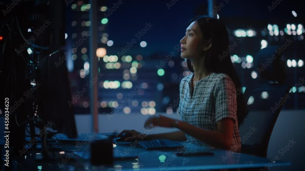 Poster portrait of a financial analyst working on computer with multi-monitor workstation with real-time st