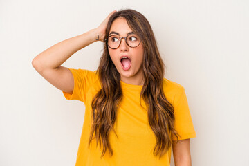Young caucasian woman isolated on white background being shocked, she has remembered important...
