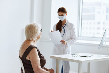 nurse in white coat patient examination health care
