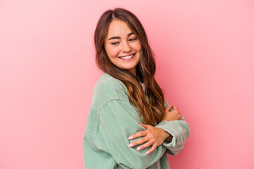 Fototapeta premium Young caucasian woman isolated on pink background laughing and having fun.