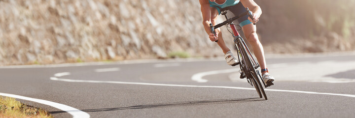 Road bike cyclist man cycling, athlete on a race cycle - obrazy, fototapety, plakaty