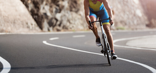 Naklejka na ściany i meble Road bike cyclist man cycling, athlete on a race cycle