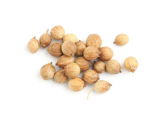 Scattered dried coriander seeds on white background, top view
