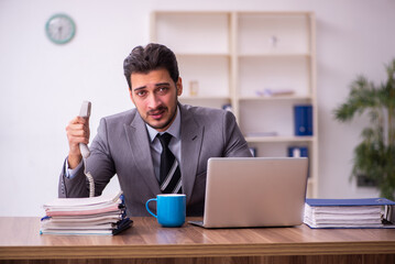 Young businessman employee working in the office