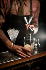 Fototapeta na wymiar beautiful clear martini glass full of ice on bar counter