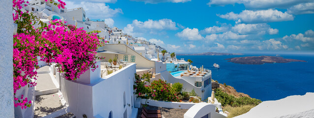 Beautiful panoramic view on the mediterranean blue sea, caldera and volcano. Traditional white...