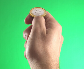 Hand hold money coin on bet concept.