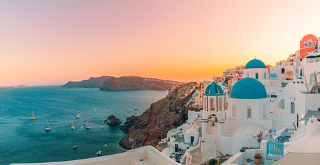 Panoramic summer destination. Traveling concept, sunset scenic famous landscape Santorini island, Oia, Greece. Caldera view, colorful clouds, dream cityscape. Vacation panorama, amazing outdoor scene - obrazy, fototapety, plakaty