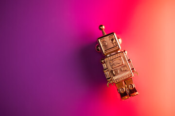 golden robot on purple and pink background. to use as background for presentations or banner