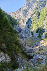 Fototapeta na wymiar Entrance to White Valley (Valea Alba in Romanian), a popular but unmarked hiking route in Bucegi mountains, Romania. Mountaineering, rock scrambling, vertical.
