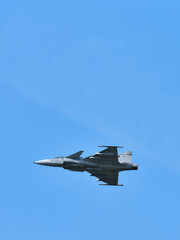 Fototapeta na wymiar Fighter in flight in the sky