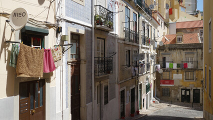 Fototapeta premium Traditional alley of Lisbon, Portugal