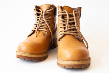 Light brown leather shoes on a white background