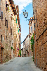Fototapeta na wymiar Alley in historical village Pienza in Tuscany, Italy