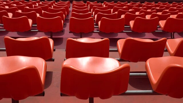 Many empty seats in the stadium.