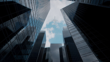 Fototapeta na wymiar 3D rendering glass buildings with air plane on blue sky background.
