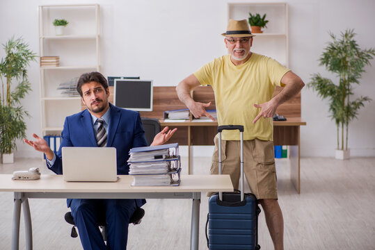 Old boss and young male employee in summer vacation concept