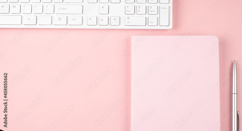 Poster pink office desk with keyboard and notebook.top view with copy space