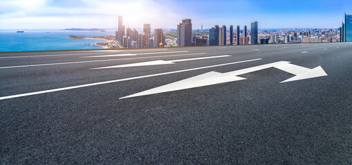 Fototapeta premium Panoramic skyline and empty asphalt road with modern buildings