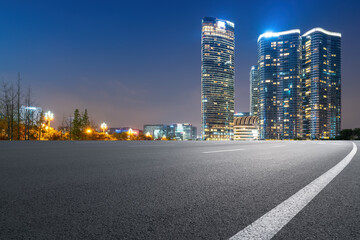 Fototapeta na wymiar Panoramic skyline and empty asphalt road with modern buildings