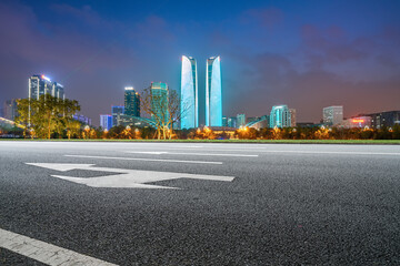Fototapeta na wymiar Panoramic skyline and empty asphalt road with modern buildings