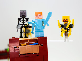 Obraz premium Minecraft. Alex, wither skeleton and blaze. Lego toys. Nether Fortress. Video game characters. Plastic dolls. Toys for children. Isolated white. Hero and Villains, mustruos, creatures.