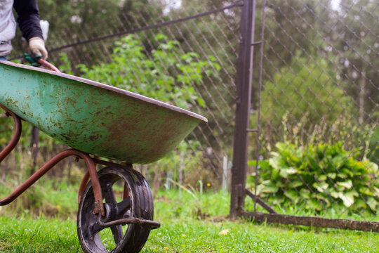 Gardening Tools. Agricultural concept. Farming season. Farmer with a wheelbarrow