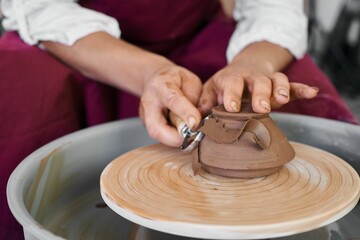making ceramic pottery on a potter's wheel