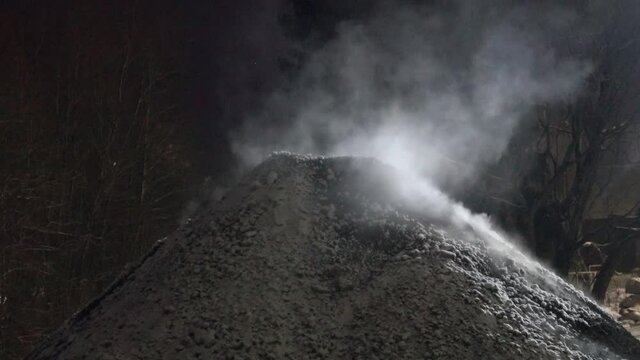 Nut coal was burned in stoker and collected in pile, local steam heating. Snow falls on warm coal and turns into steam, snow sublimation. Heat and gas pollution, refuse burnout