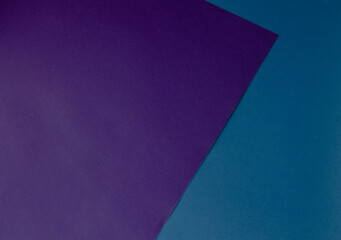 blue paper on a background of purple paper. colored background