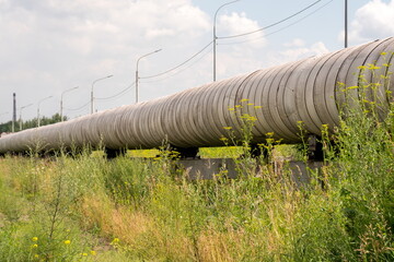Ground pipeline of the city heating main of the main heating network on a reinforced concrete...