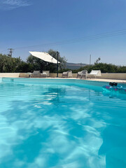 Beautiful swimmingpool in summer in italy
