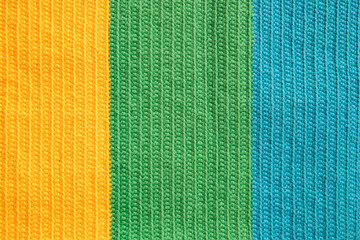 Eye-pleasing crochet pattern in three different soft colors yarn: yellow, green and blue cotton...
