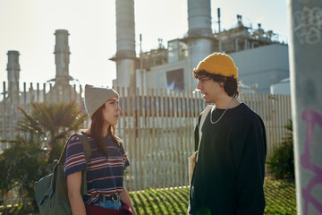 Two involved young people having a chat outside