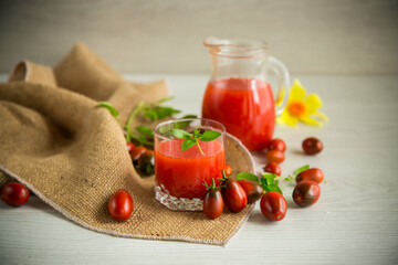 homemade freshly squeezed tomato juice with pulp in a glass decanter