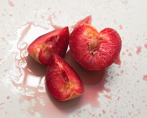 Cutted of Plumcot fruit with red pulp